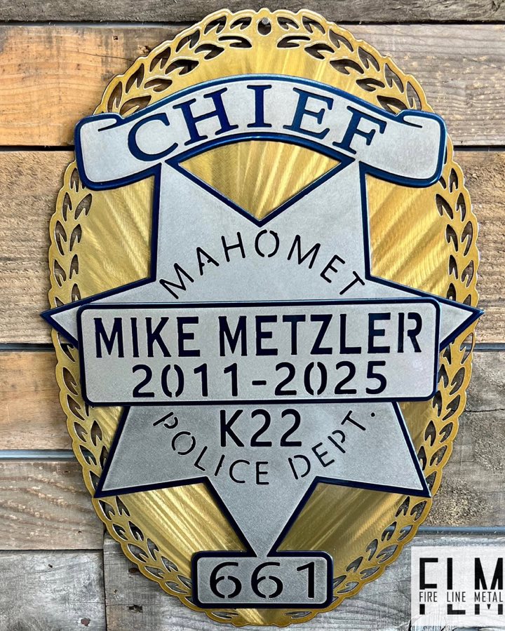Layered plasma cut Mahomet Police Department chief retirement badge in gold, silver, and blue
