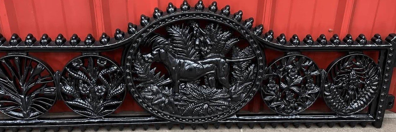 Cast iron bench back after sandblasting and black powder coat