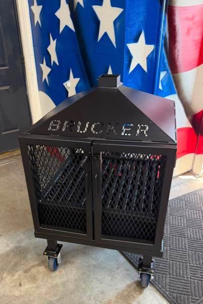 Custom steel fire pit on casters with a top and a set of doors