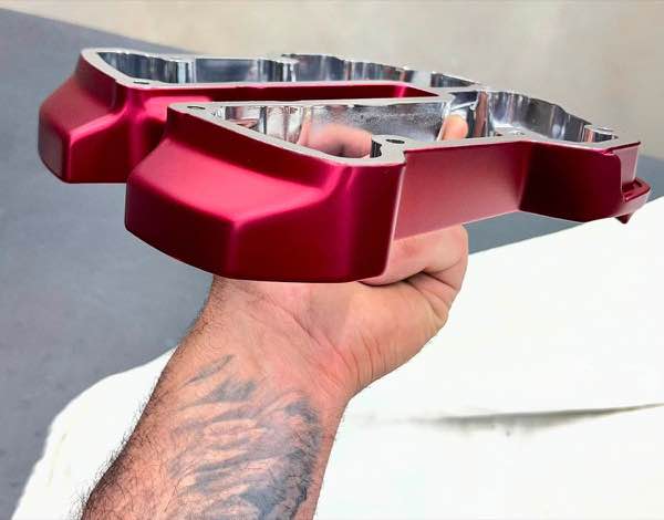Harley part in a red anodized powder coat finish