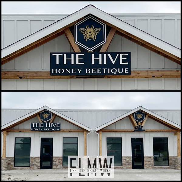2 layer plasma cut and powder coated building signs installed on The Hive Honey Beetique storefront