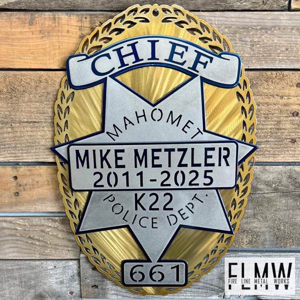 Layered plasma cut Mahomet Police Department chief retirement badge in gold, silver, and blue