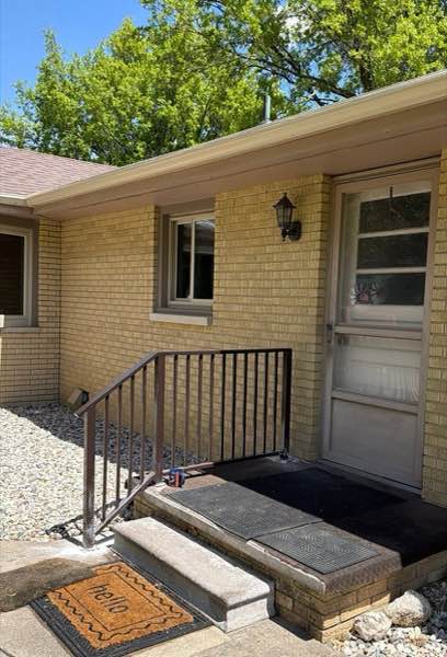 Custom steel stair railing installed on the front steps of a brick home in Paxton, Illinois