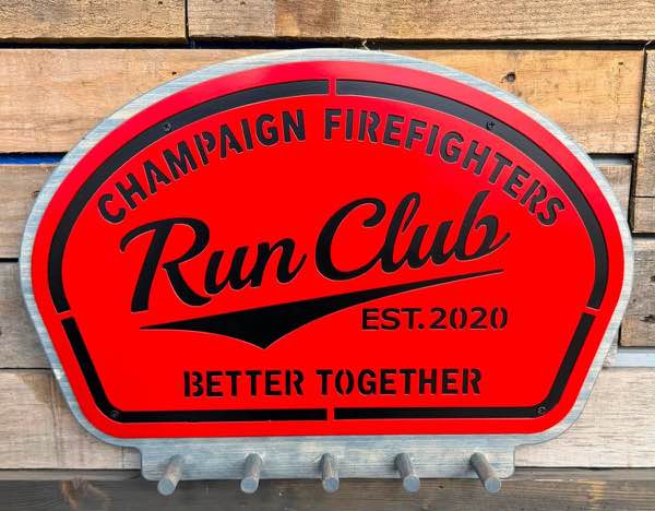 Champaign Firefighters Run Club plasma cut sign in red and black with hooks