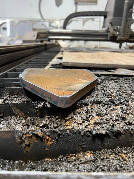 Piece of three quarter inch thick steel plate cut on the CNC plasma table