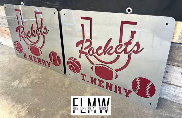 Plasma cut school team signs with football, basketball, and baseball, in maroon and silver